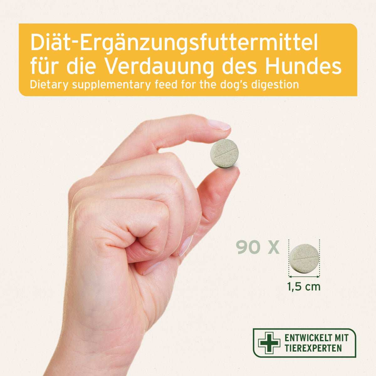 Hand die Magen & Darm Tablette in der Hand hält. 